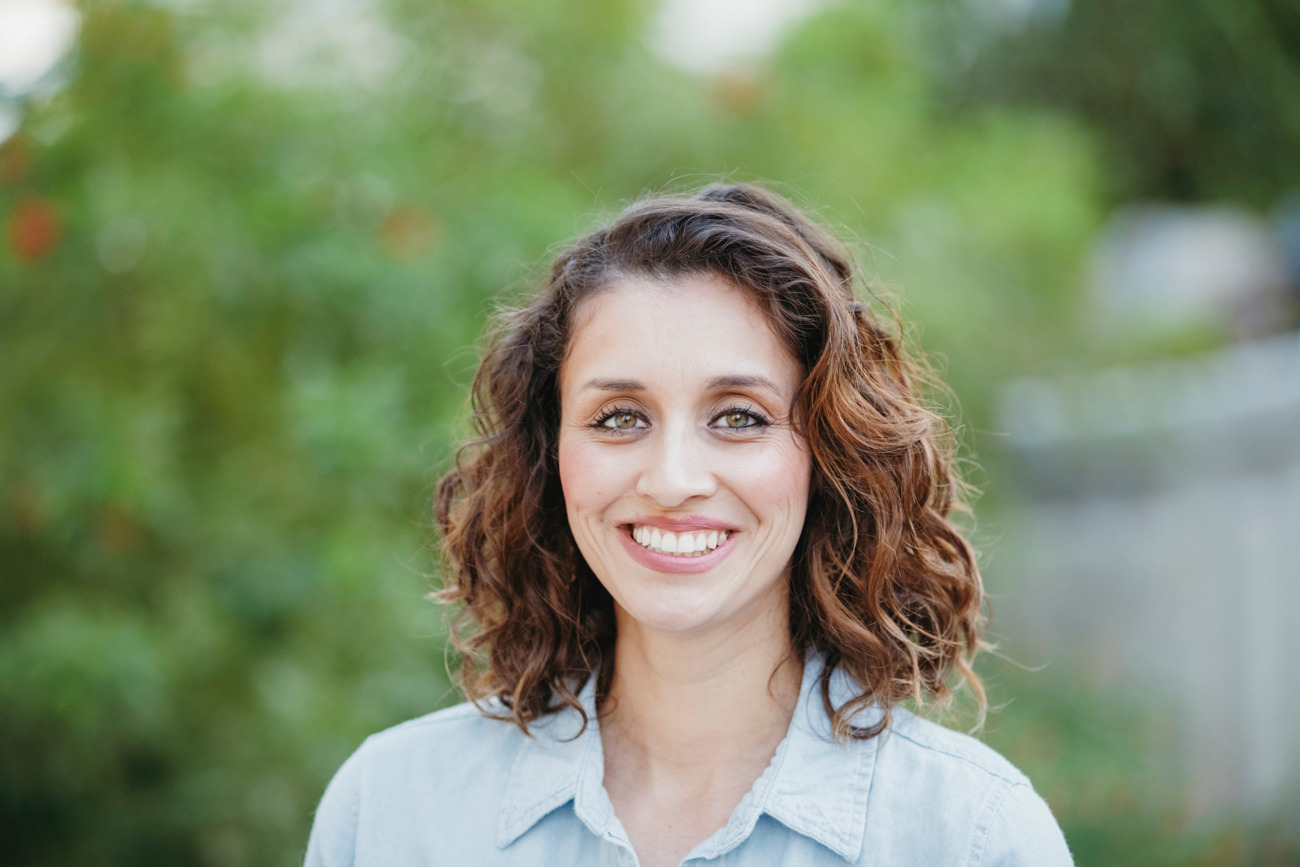 Close-up portrait of happy woman standing in yard